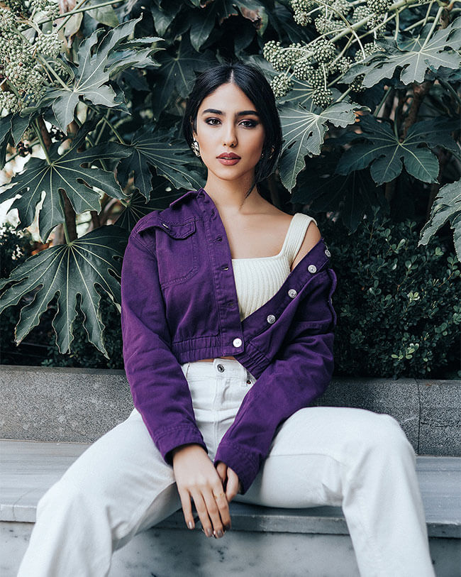 Ramina Turabi, a famous Iranian model, wearing a purple dress in Istanbul